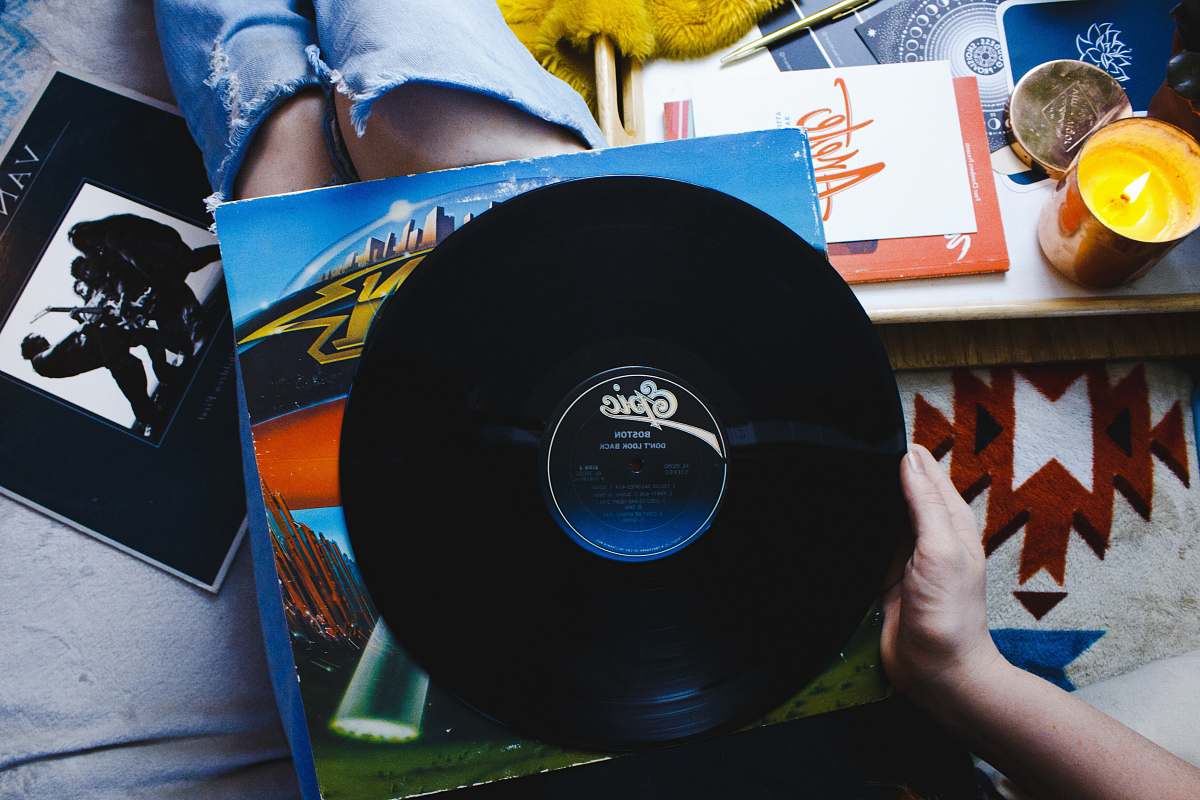 united states person holding Epic vinyl record black